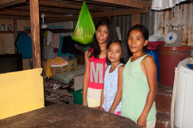 Jennelyn and her daughters inside their home - which now has loft for private sleeping quarters for the family.